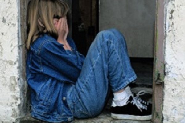 sad young girl sitting