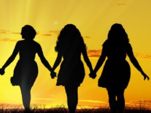 ladies walking hand in hand